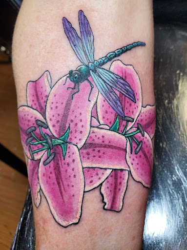 Explore neck tattoo ideas for women, creative tattoo ideas in Independence, available at Odins Mark Tattoo and Emporium