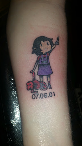 Find tattoo between breast ideas for your next unique tattoo in Carbondale at Tuff Luck