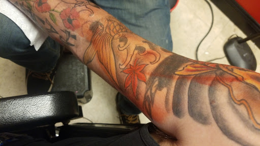 Explore mens tricep tattoo ideas, creative tattoo ideas in Spartanburg, available at Lucky Dice Tattoo Shop Spartanburg