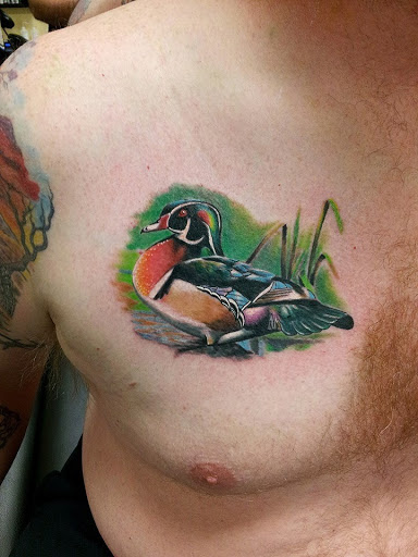 Explore kaws tattoo ideas, creative tattoo ideas in Port Saint Lucie, available at Timeless Tattoo Co