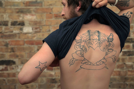 Explore yorkie tattoo ideas, creative tattoo ideas in Milwaukee, available at Removery Tattoo Removal & Fading