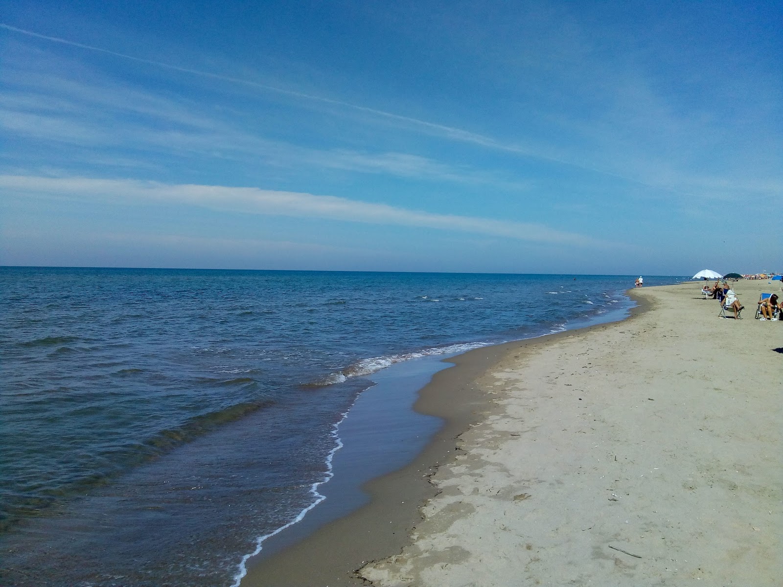 Foto av Stella Marina med lång rak strand