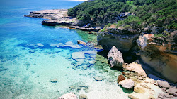 Foto von Cala del Brucato und seine wunderschöne Landschaft