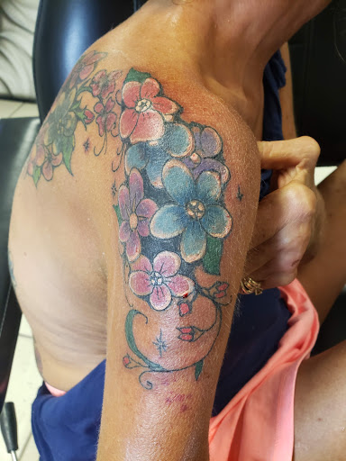 Explore dirt bike tattoo ideas, creative tattoo ideas in Hudson, available at Inkredible Inc Tattoos