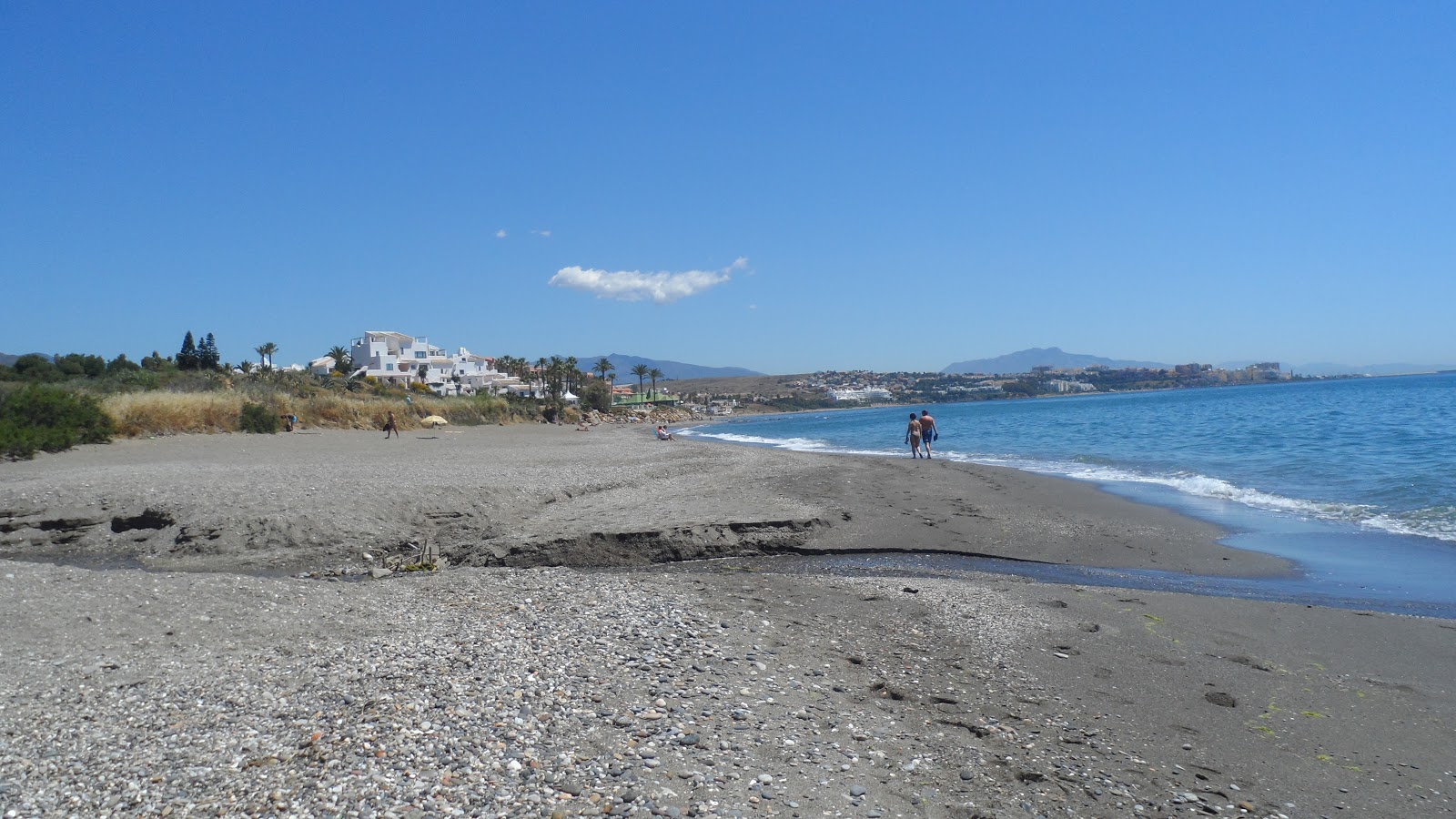 Foto de Playa Arroyo Vaquero com areia cinza superfície