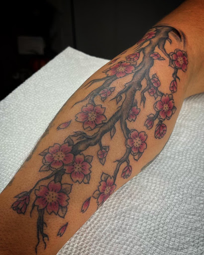 Explore cross hand tattoo ideas, creative tattoo ideas in Webster, available at Mainline Ink