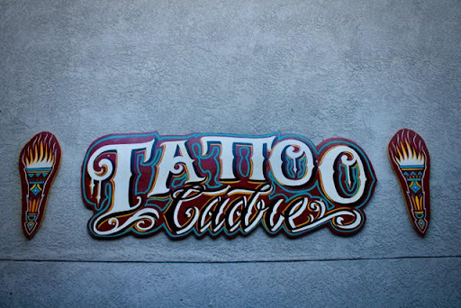 Explore 2 cat tattoo ideas, creative tattoo ideas in Albuquerque, available at Tattoo Cadre