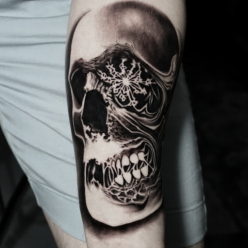 Explore bite mark tattoo ideas, creative tattoo ideas in Fayetteville, available at Sacred Raven Tattoo Shop