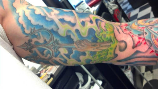 Explore small dog tattoo ideas, creative tattoo ideas in Pelham, available at Tattoo Fever