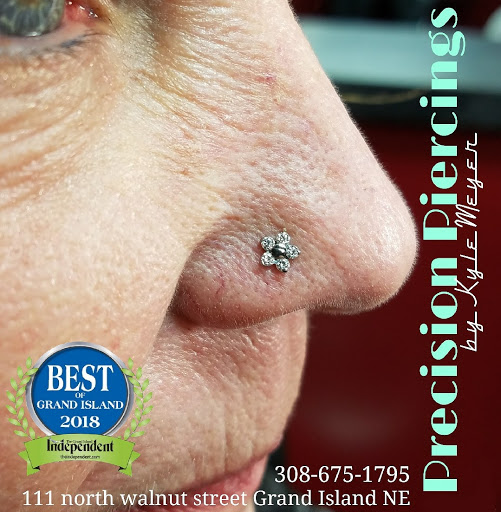 Explore tomahawk tattoo ideas, creative tattoo ideas in Grand Island, available at Precision Piercings