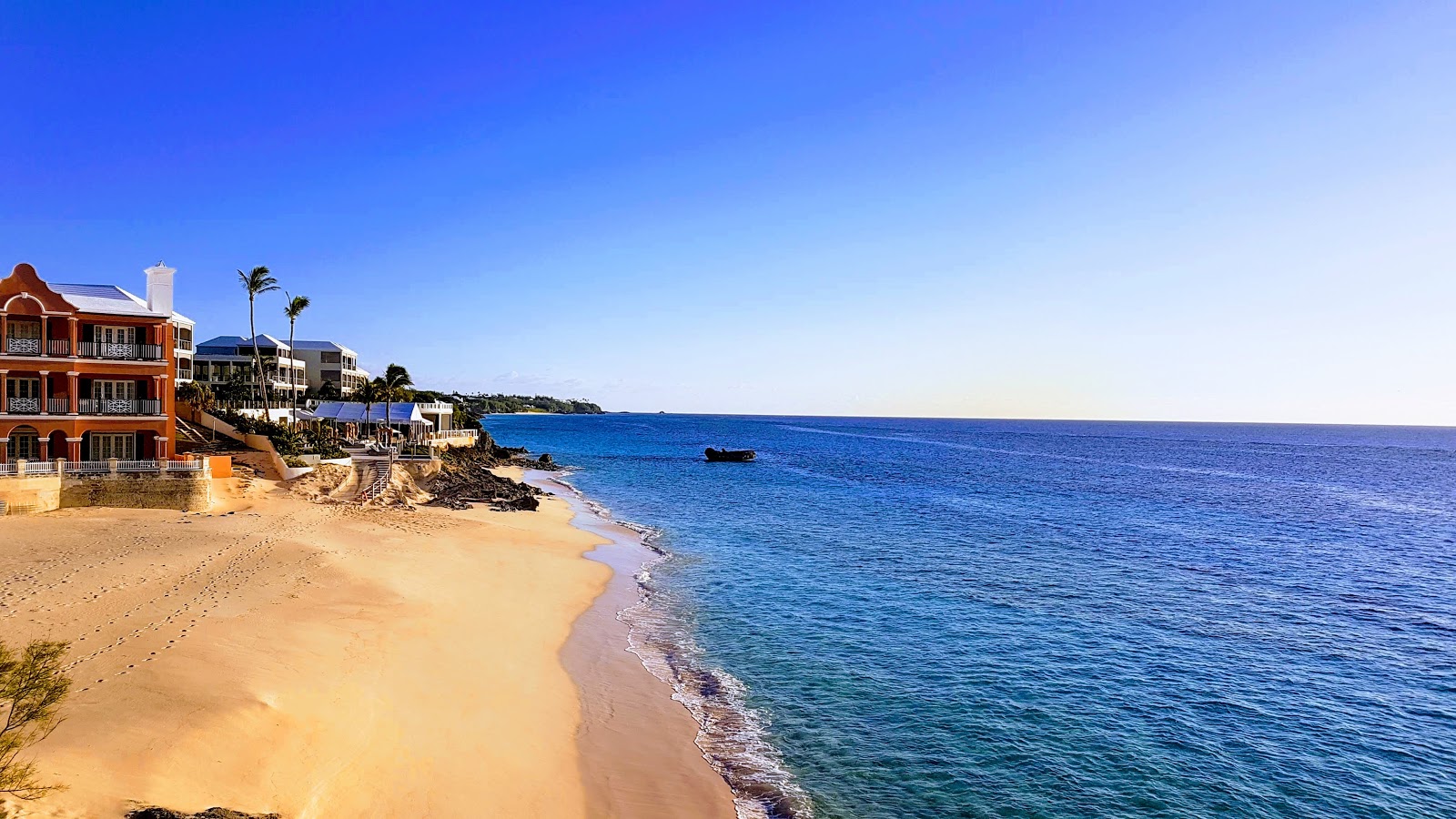 Photo of Pink Beach - West and the settlement