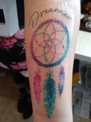 Explore fighting tattoo ideas, creative tattoo ideas in Cheyenne, available at The T.R.I.B.E. Zoo, LLC Tattoo