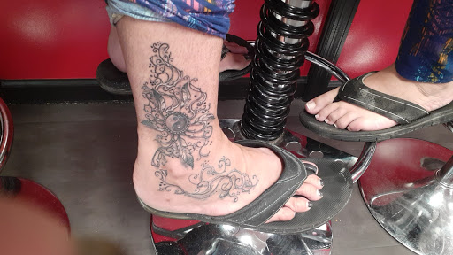 Explore dainty flower tattoo ideas, creative tattoo ideas in Beaufort, available at Beaufort Tattoo Kompany