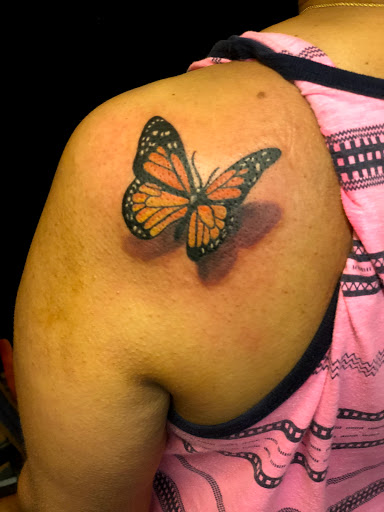 Explore yellow rose tattoo ideas, creative tattoo ideas in Starkville, available at Xclusive Ink Tattoo Company