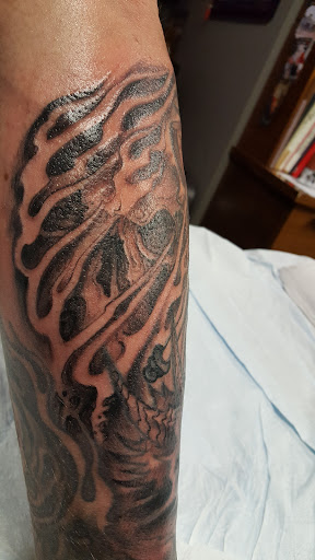 Explore gangster tattoo ideas for men, creative tattoo ideas in Nyack, available at Vanguard Tattoo