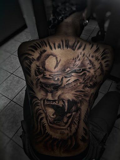 Explore mens thigh tattoo ideas, creative tattoo ideas in Lavonia, available at 1890 Tattoo Co.