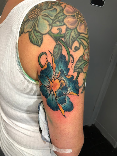 Explore thigh hip tattoo ideas, creative tattoo ideas in Largo, available at Alchemy Tattoos and Body Piercings