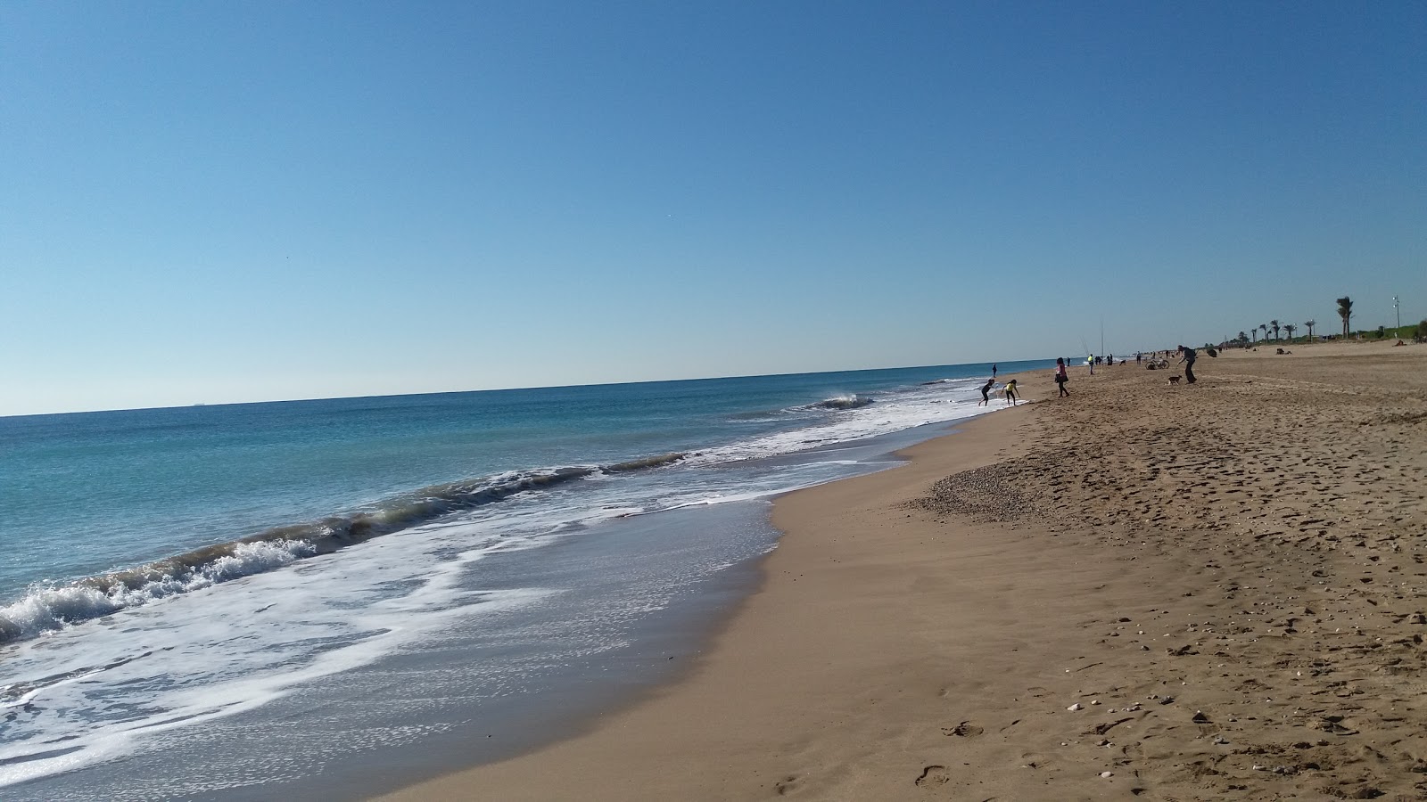 Fotografie cu Platja del Prat cu o suprafață de nisip maro
