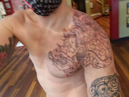 Explore ouroboros tattoo ideas, creative tattoo ideas in Baltimore, available at Read Street Tattoo Parlor