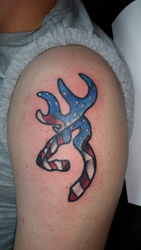 Explore bicep tattoo ideas for guys, creative tattoo ideas in Foley, available at Black Sheep Custom Tattoos and Piercings