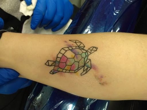 Explore trolls tattoo ideas, creative tattoo ideas in Panama City Beach, available at Revolution Tattoo & Body Piercing