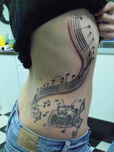 Explore christmas tree tattoo ideas, creative tattoo ideas in Pelham, available at Tattoo Fever