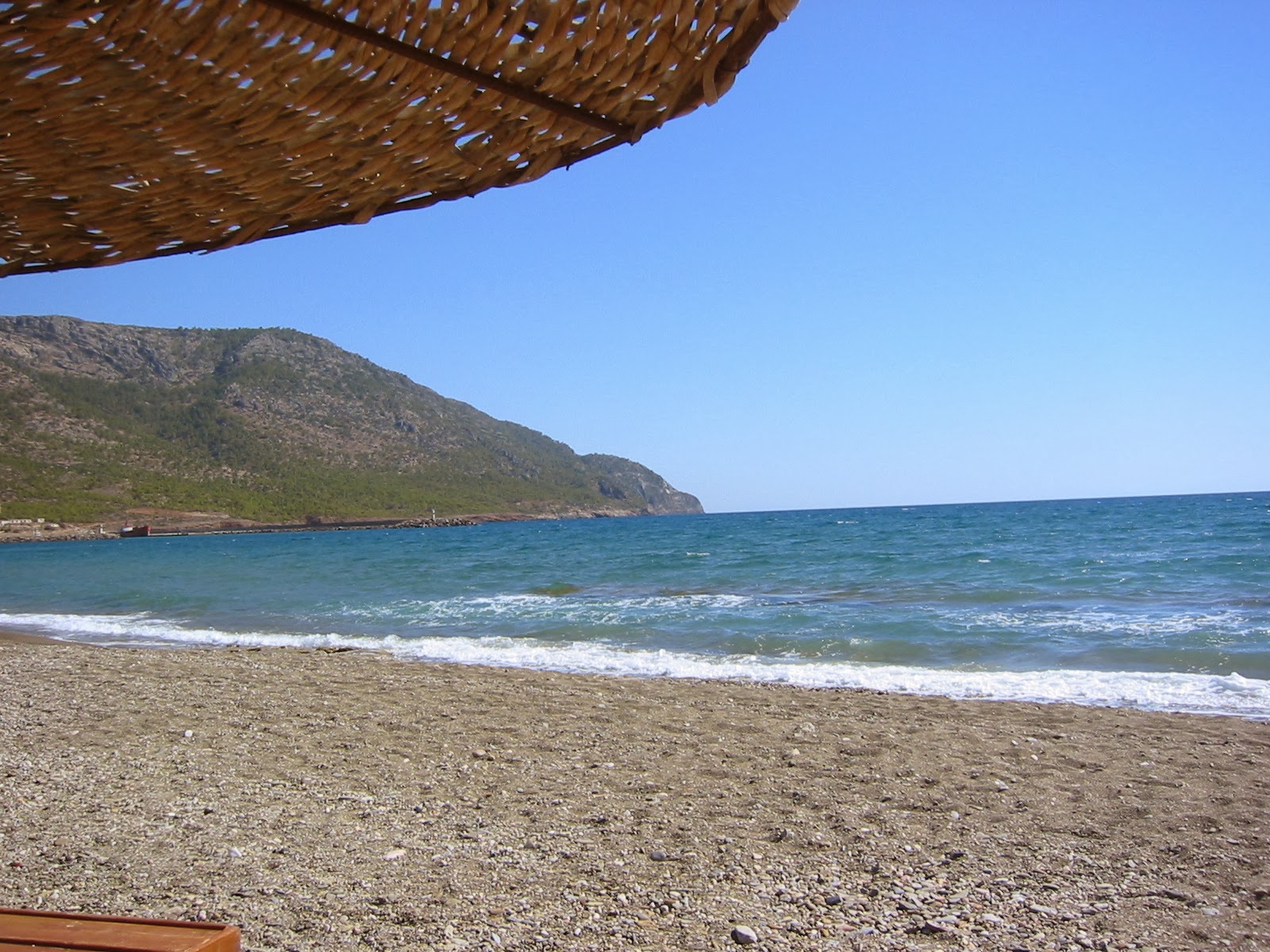 Photo de Ovacik beach avec l'eau turquoise de surface