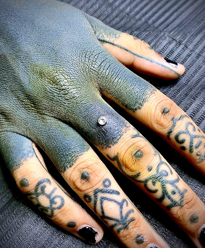 Explore bi tattoo ideas, creative tattoo ideas in Orange, available at Symbiosis Body Piercing