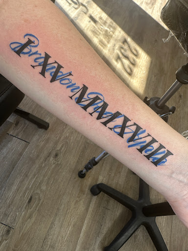 Explore roman numerals tattoo idea, creative tattoo ideas in Titusville, available at Space Coast Ink Tattoo Studio