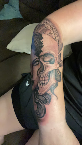 Explore child tattoo ideas, creative tattoo ideas in Lawrenceville, available at Black Cloud Tattoo and Piercing