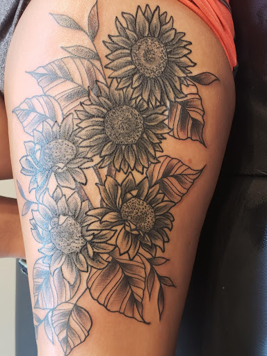 Find small sunflower tattoo ideas for your next unique tattoo in Owensboro at Lady Luck Tattoo and Body Piercing