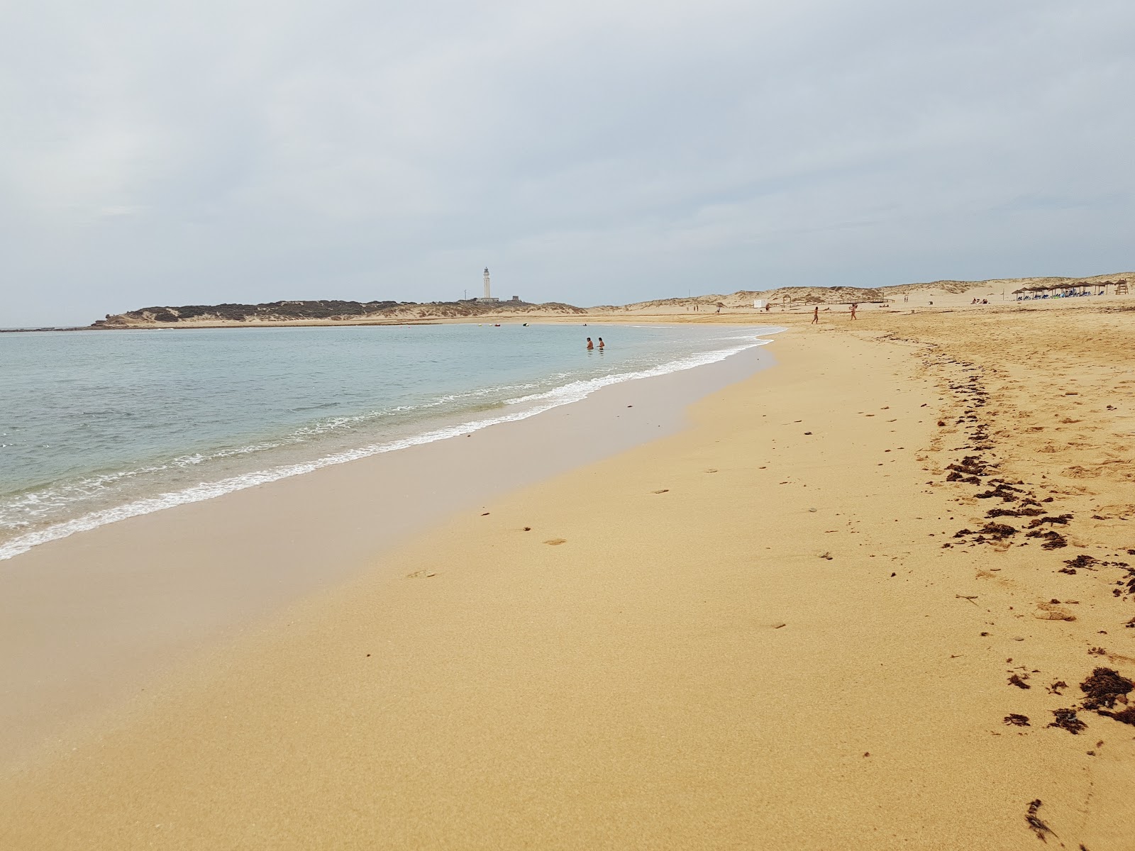 Fotografija Playa de los Canos de Meca z svetel fin pesek površino