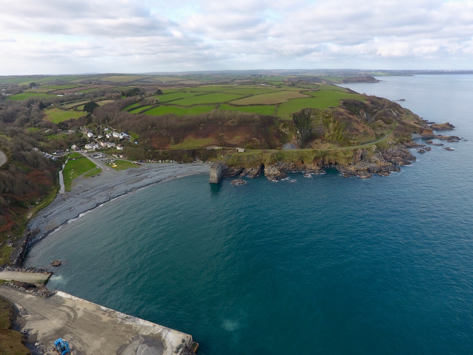 Photo of Porthoustock beach and the settlement