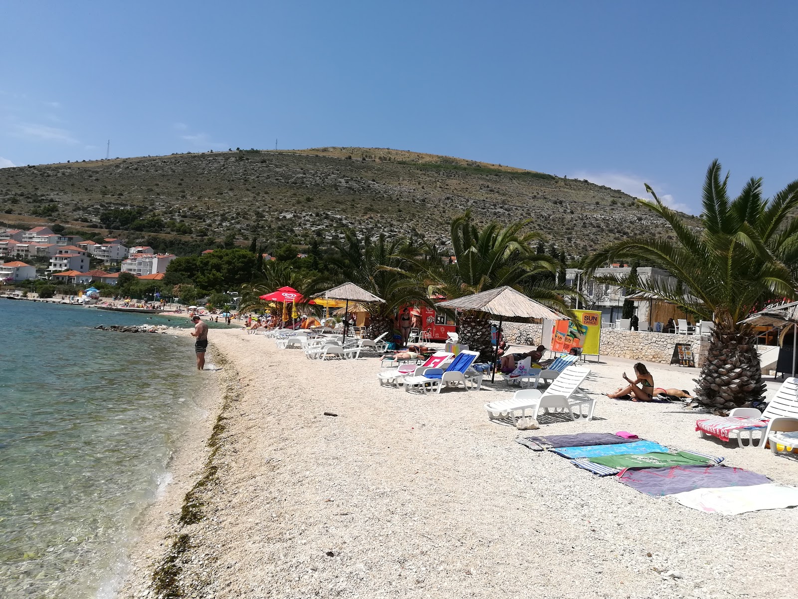 Fotografie cu Plaja Seget zonă de stațiune de pe plajă