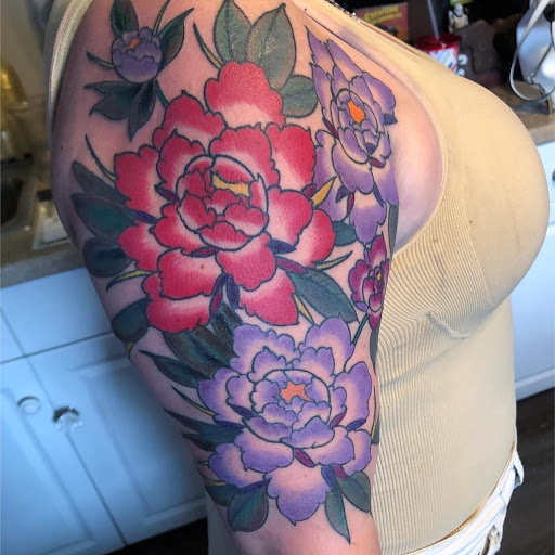 Explore flower ankle tattoo ideas, creative tattoo ideas in Saint Augustine, available at Ms. Deborahs Fountain of Youth Tattoo & Body Piercing