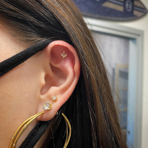 Explore fall leaf tattoo ideas, creative tattoo ideas in Cary, available at Fine Art Body Piercing By Lilith Mae