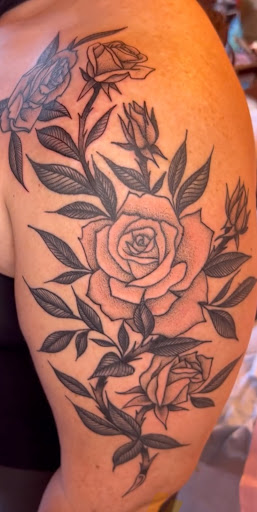 Explore solid black tattoo ideas, creative tattoo ideas in Pittsburgh, available at Black Cat Tattoos