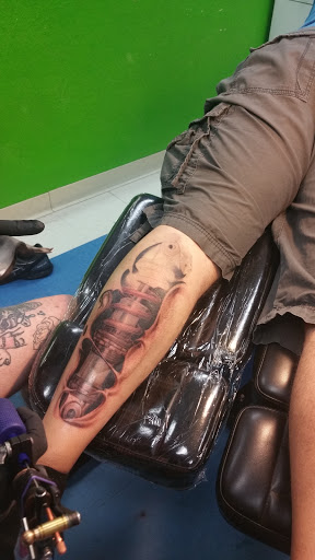 Explore garfield tattoo ideas, creative tattoo ideas in Sparks, available at Under Your Skin Tattoo & Body Piercing