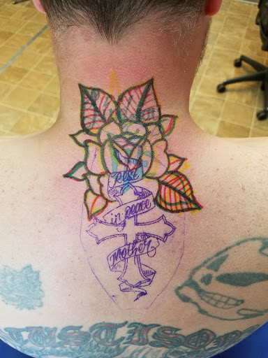 Explore small snake tattoo ideas, creative tattoo ideas in Kansas City, available at Revelation Tattoo