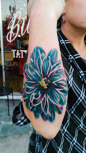 Explore soccer ball tattoo ideas, creative tattoo ideas in Sioux Falls, available at Vishnu Bunny Tattoo and Piercing