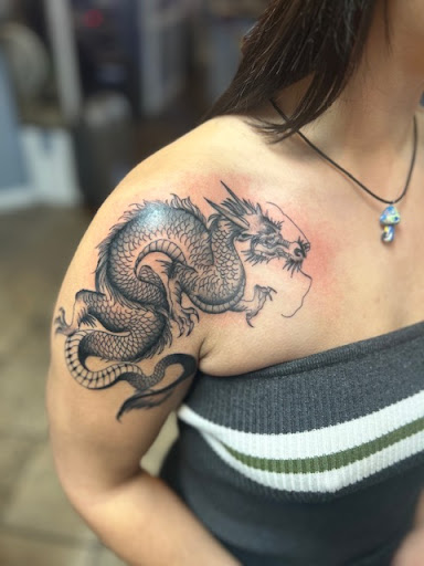 Explore flower foot tattoo ideas, creative tattoo ideas in Nashua, available at Mayhem Ink Tattoo