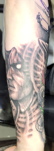 Explore eragon tattoo ideas, creative tattoo ideas in Angola, available at Hoodlum Ink