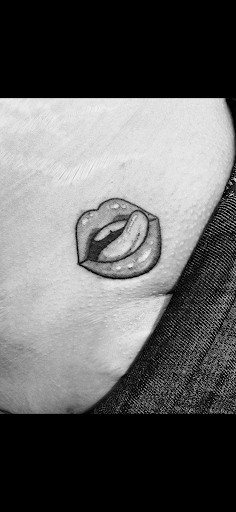 Explore tattoo ideas for womens thigh, creative tattoo ideas in Rogers, available at Ink Solutions Tattoo