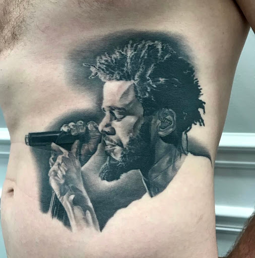 Explore womb tattoo ideas, creative tattoo ideas in Warrenville, available at UpRise Tattoos