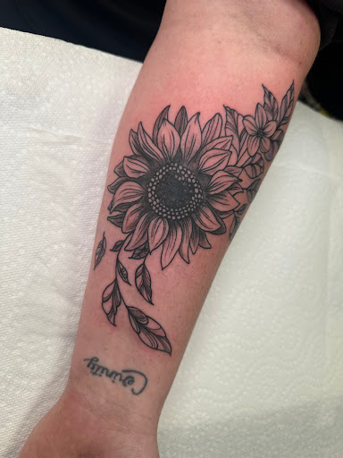 Explore female dragon tattoo ideas, creative tattoo ideas in Cleveland, available at Vanaheim Tattoo and Piercing Studio