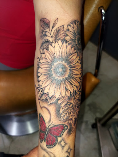 Explore lower back tattoo cover up ideas, creative tattoo ideas in Odessa, available at Little Dragon Tattoos Studio