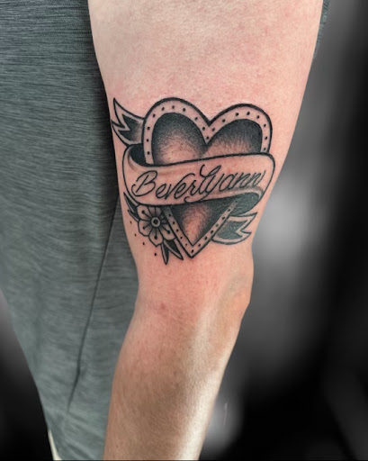 Find tattoo ideas under breast for your next unique tattoo in Marietta at The Queen Bee Tattoo and Piercing Parlour