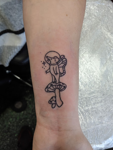 Explore photography tattoo ideas, creative tattoo ideas in Slippery Rock, available at Dinky Dachshund Tattoo Parlor