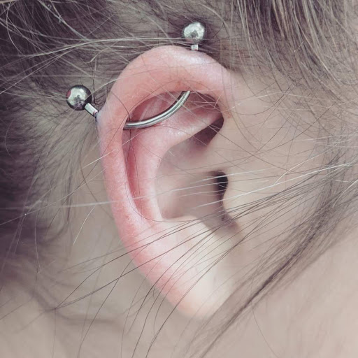 Explore forearm flower tattoo ideas, creative tattoo ideas in Green Bay, available at Colourbox Body Piercing Llc