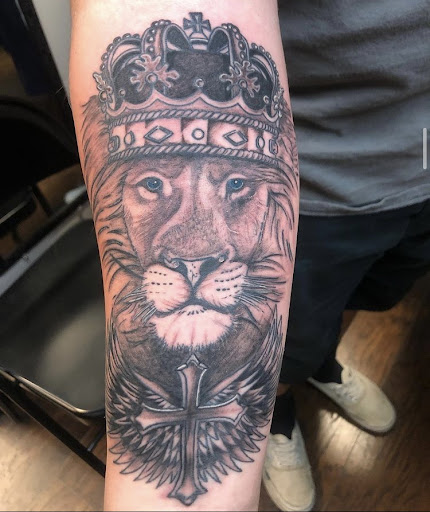 Explore hand tattoo ideas for man, creative tattoo ideas in Alamosa, available at The Shop Tattoo & Comics